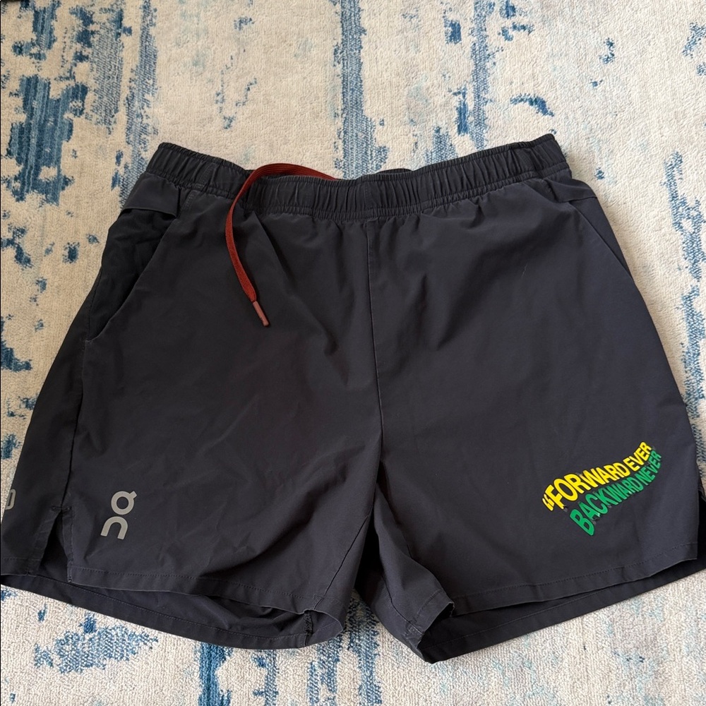 On Running Black Shorts with Vibrant Logo